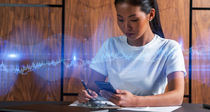 Woman,Takes,Notes,With,Phone.,Forex,Graph,And,Chart,Online | Online Trading Secrets