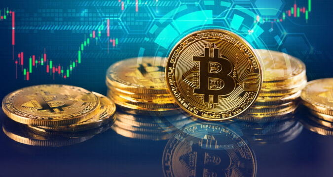 BitcoinsAndNewVirtualMoneyConceptgoldBitcoinsWithCandleStick | Online Trading Secrets This Week in Crypto - Standard Chartered Predicts a Bitcoin Price Rally to $135,000 in Q3